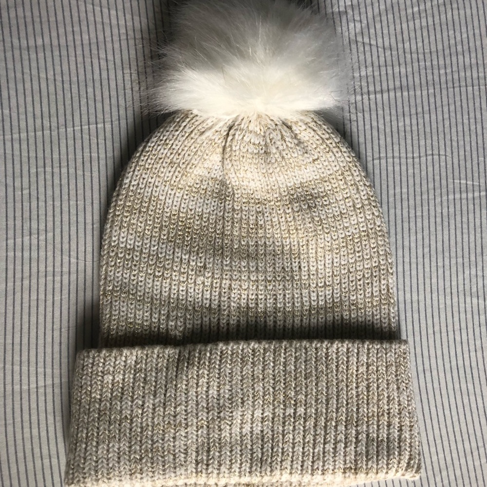 Beige winter beanie with white Pom pom